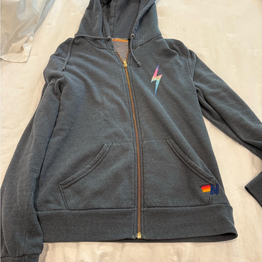 Gray zip up hoodie  with Lightning Bolt by Aviator Nation